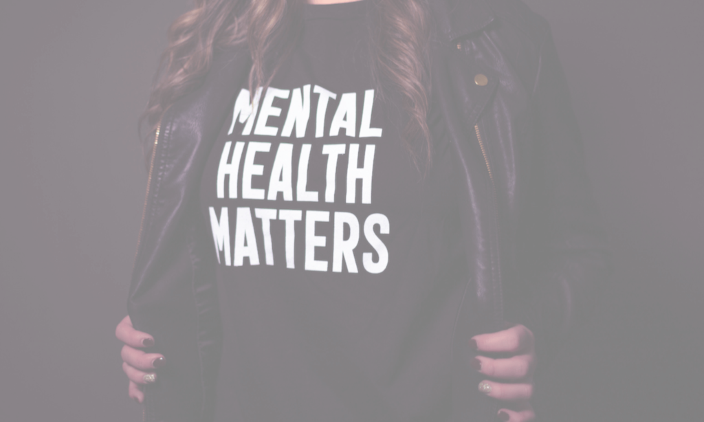 Woman holding her leather jacket open with a t-shirt underneath it reading "Mental Health Matters". Christian Stress Release Membership - Learn the Techniques Series. An on-demand video and audio library of mental health techniques to help Christian women release stress and find peace and balance in their everyday lives.
